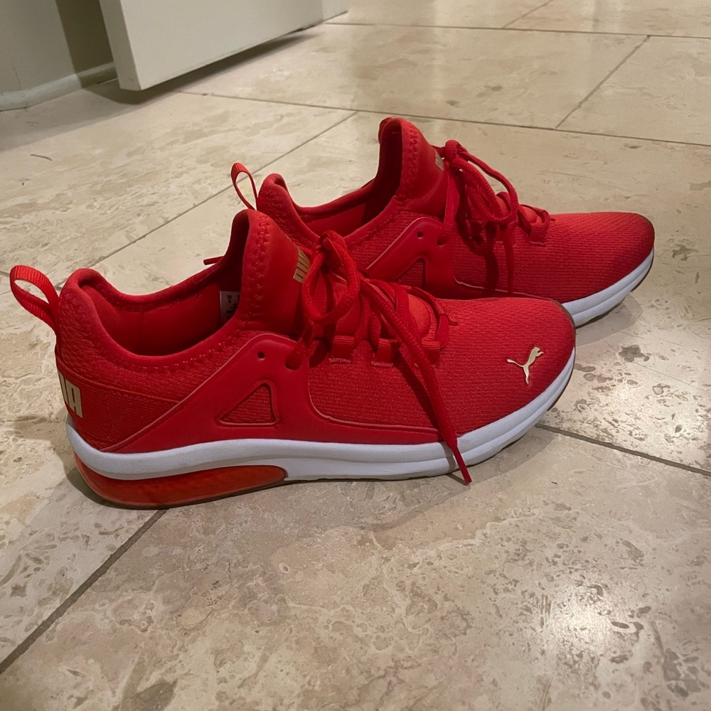 Red woman’s puma shoes